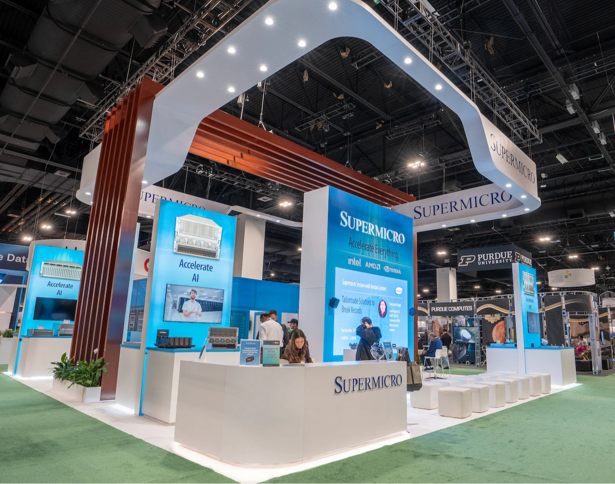 Supermicro booth at a trade show with branding and product displays.